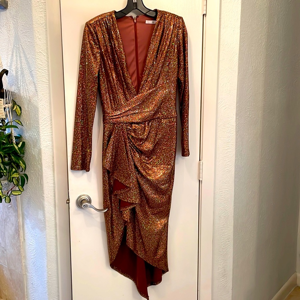 Dress shimmers in the light! Satin style lined fabric, sleeves thinly lined